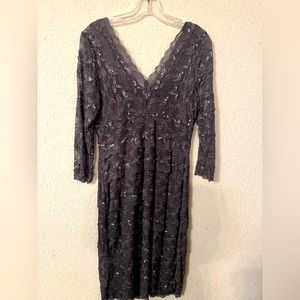 Sequined dress, knee length, V in the front and the back.